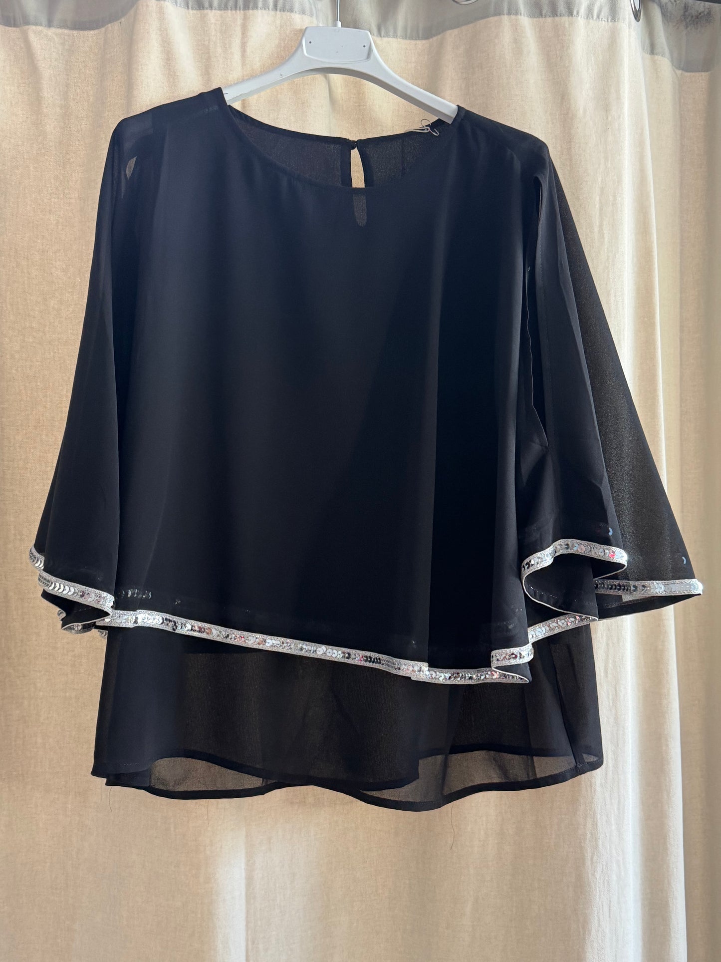 Blusa elegante con pailettes