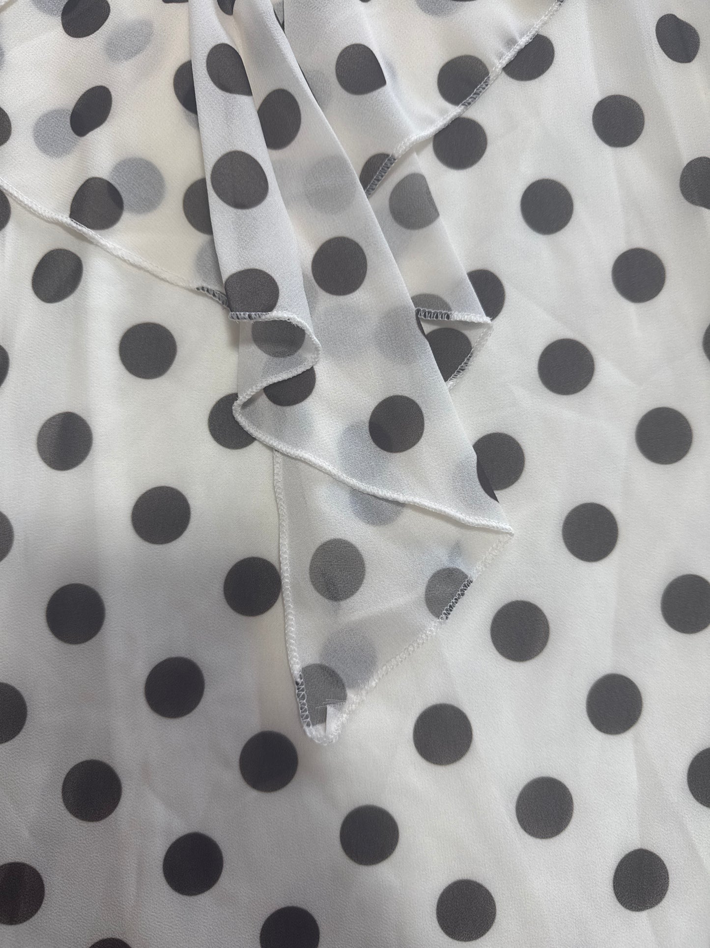 Blusa smanicata a pois